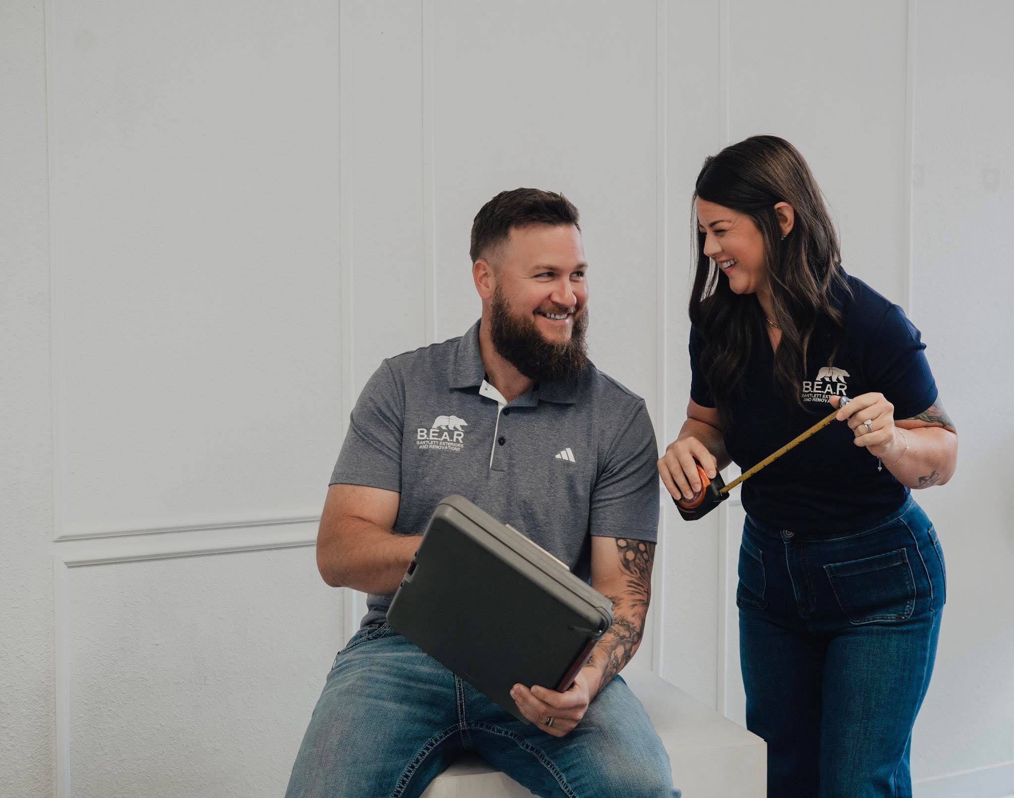 Colin and Shaina sharing a laugh while working