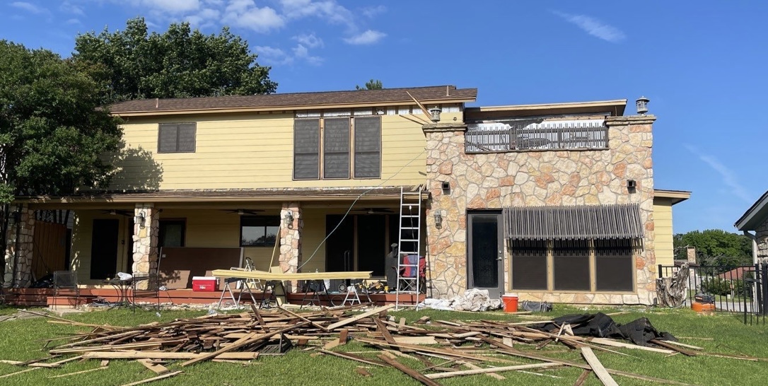 Back of home during renovation showing old siding removal